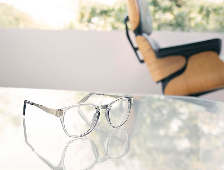 Fashion lifestyle photography of Oliver Peoples clear frame glasses